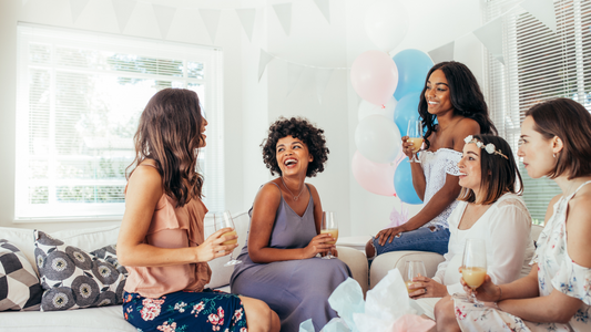 friends gathered at baby shower celebrating pregnancy