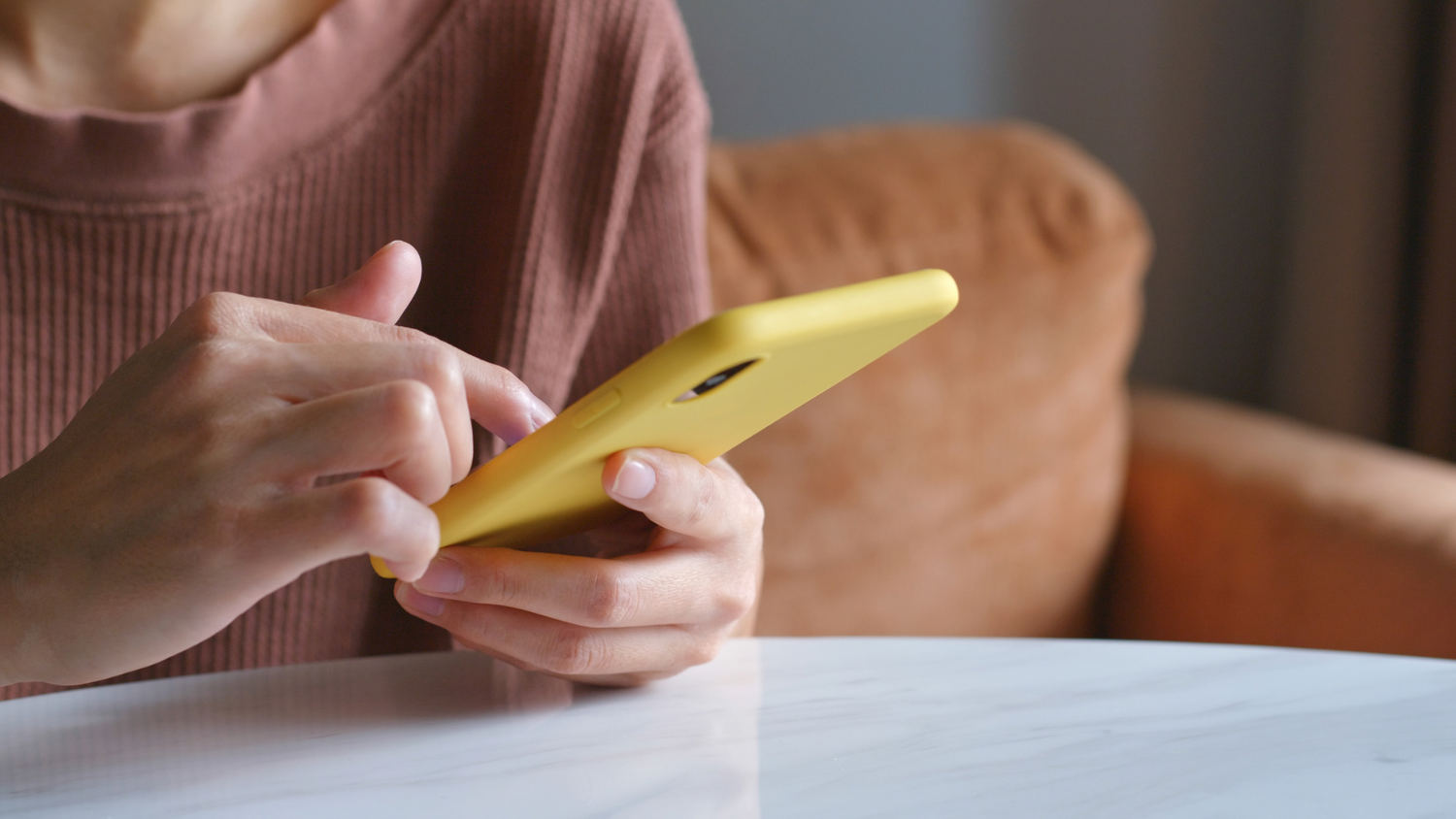 Mum recording baby memories and milestones on phone while baby sleeping