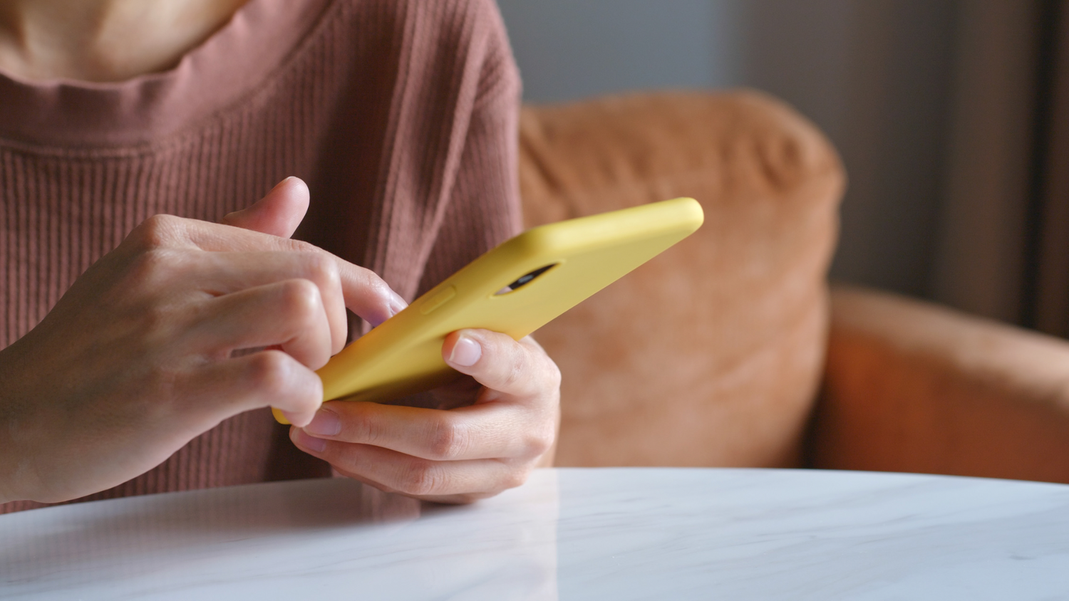 Mum recording baby memories and milestones on phone while baby sleeping 