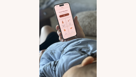 mum making baby book on phone while nap trapped
