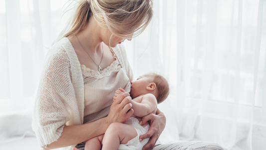 mom breastfeeding baby while standing up