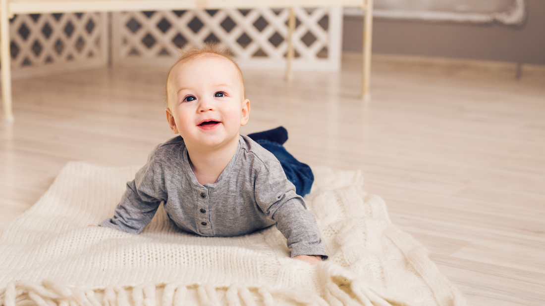 baby doing tummy time on mat