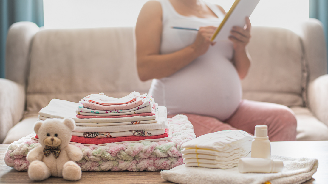 pregnant lady making a list of things to do before baby arrives
