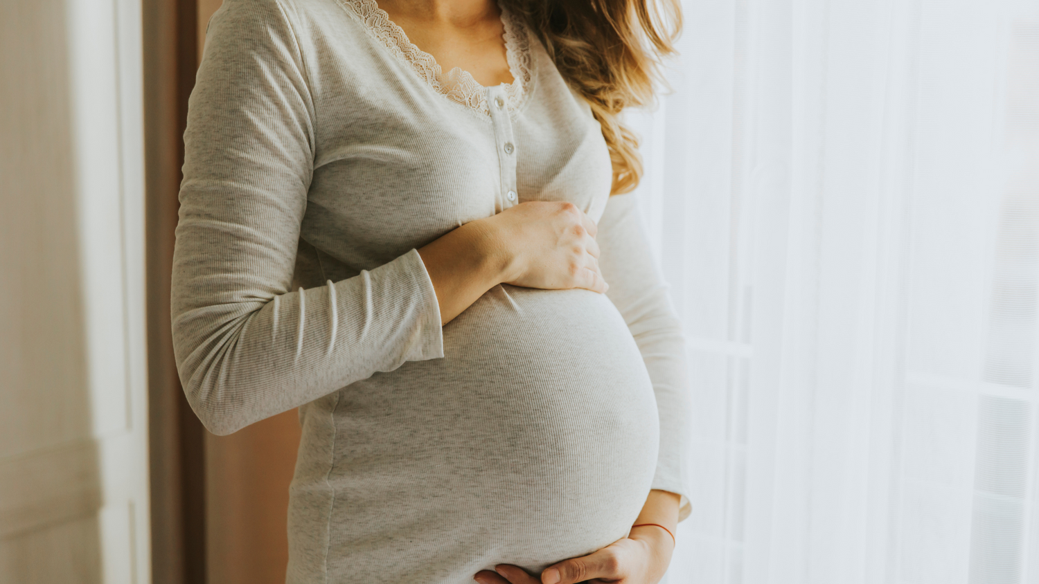 pregnant lady holding her bump